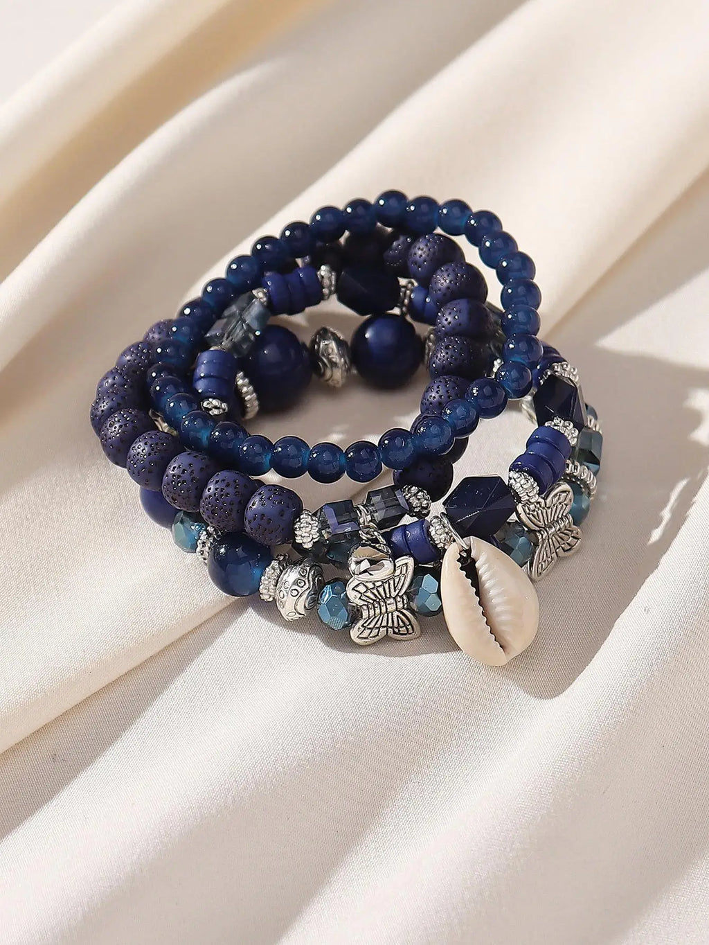 4-Piece Layered Blue Beaded Bracelet Set with Butterfly & Shell Charms
